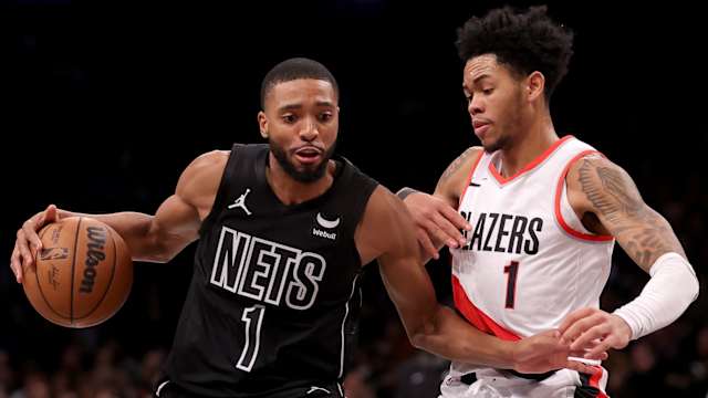 Brooklyn Nets forward Mikal Bridges (1) controls the ball against Portland Trail Blazers guard Anfernee Simons (1)
